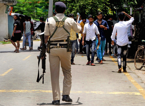 South 24 Pargana: Police personnel disperse the crowd near polling booths during the Panchayat polls in South 24 Parganas district of West Bengal, on Saturday, July 08, 2023. (Photo: IANS/Kuntal Chakrabarty)