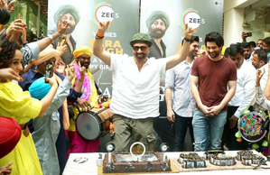 Sunny Deol cuts b'day cake with son Karan, Rajveer; grooves to dhol beats