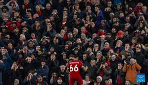 Liverpool supporters react after a miss from Trent Alexander-Arnold during the English Premier League match between Liverpool and Arsenal in Liverpool, Britain, Dec. 23, 2023. (Xinhua)