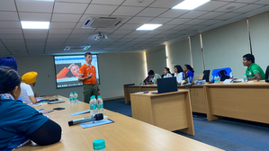 Herman Kruis conducts a workshop on modern techniques for leading hockey academy coaches