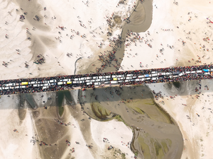 Prayagraj: A drone captures an aerial view of the massive crowd and traffic congestion on a bridge during the Maha Kumbh Mela 2025, with devotees gathering on the riverbanks for holy rituals, in Prayagraj, on Wednesday, January 29, 2025. (Photo: IANS) 