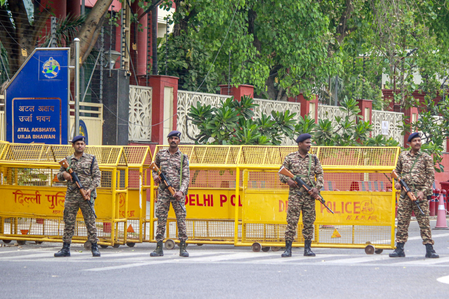 New Delhi: Delhi Police and Central Industrial Security Force (CISF) personnel stand guard outside the National Investigation Agency (NIA) headquarters in New Delhi on Friday, April 11, 2025. (Photo: IANS/Qamar Sibtain)