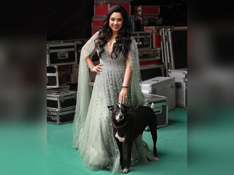 Rupali Ganguly is joined by one of her 'bachchas' as she poses for some solos