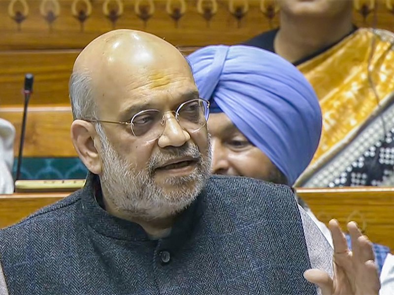 Union Home Minister Amit Shah speaks in the Lok Sabha during the winter session of Parliament in New Delhi on Wednesday, December 10, 2025. (Photo: IANS/Video Grab/Sansad TV)