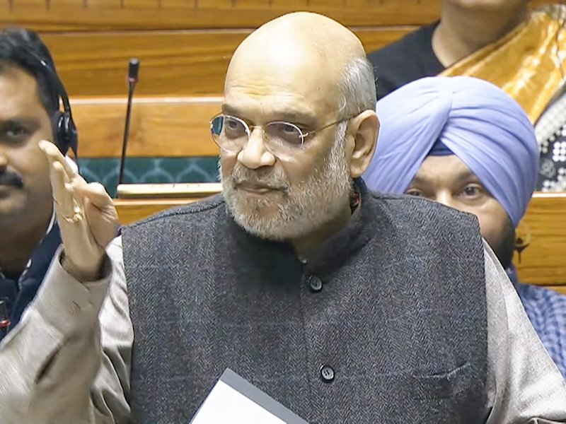 Union Home Minister Amit Shah speaks in the Lok Sabha during the winter session of Parliament in New Delhi on Wednesday, December 10, 2025. (Photo: IANS/Video Grab/Sansad TV)