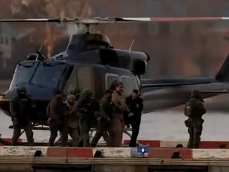 Venezuela’s leader Nicolas Maduro is taken off a helicopter in New York on Monday, January 5, 2026, on his way to a federal court. Behind him is his wife Cicilia Flores. (Photo Source: C-Span)