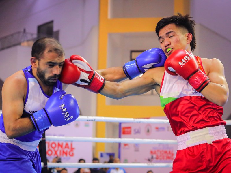 Jadumani Singh, Pawan Bartwal set up final clash with easy semifinal victories in the Elite Men and Women National Boxing Championships at Gautam Buddha University, Greater Noida, on Friday. Photo credit: BFI