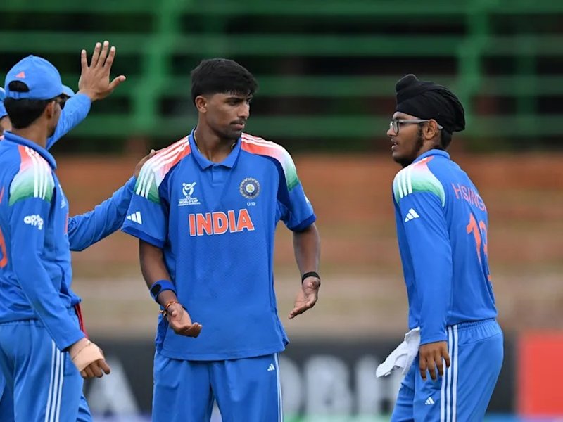 Henil Patel's five-wicket haul helps India beat USA by six wickets via DLS Method in the ICC Under-19 Men's Cricket World Cup in t the Queens Sports Club in Bulawayo on Thursday. Photo credit: ICC