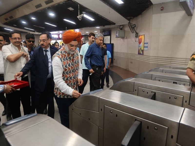 Delhi L-G Sandhu travels in Metro, poses for selfies with youth 