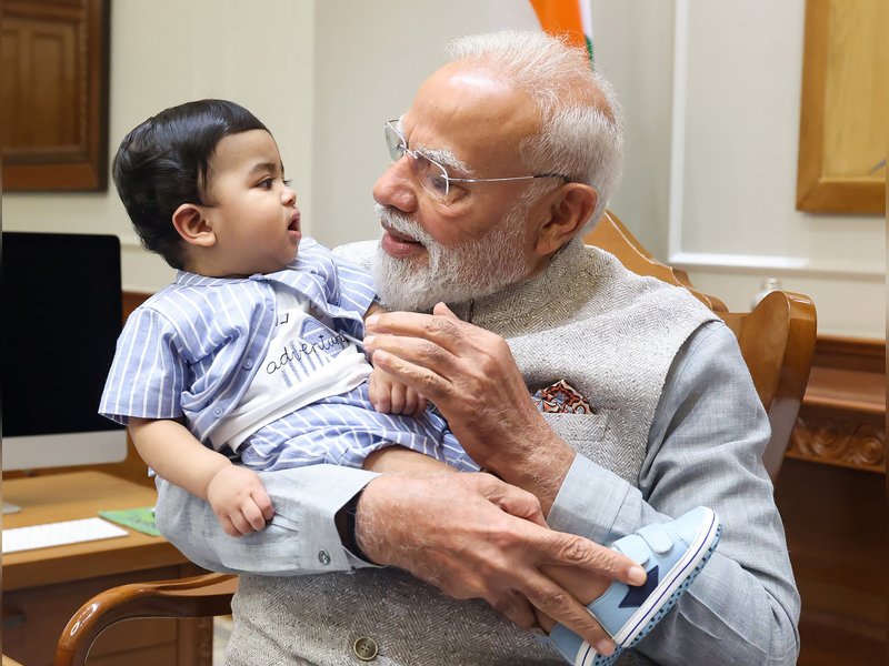 PM Modi cradles little Omy, melts hearts across social media​