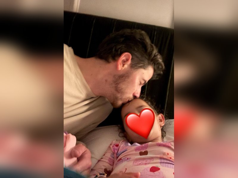 Nick Jonas shares adorable pic of him kissing little Malti Marie while putting her to sleep
