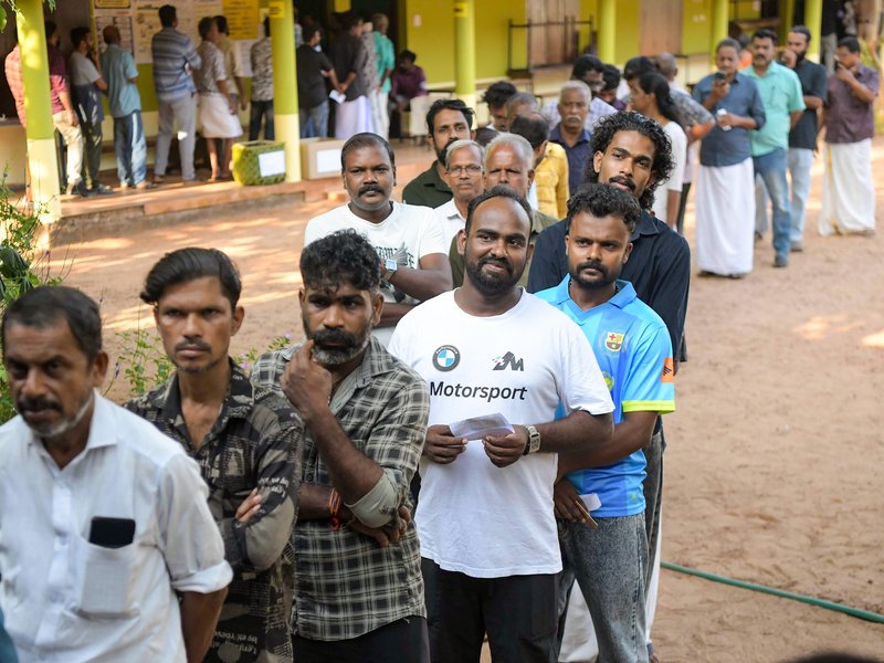 Kochi: People stand in a queue at a polling booth to cast their votes during the Kerala Assembly elections in Kochi on Thursday, April 9, 2026. (Photo: IANS)