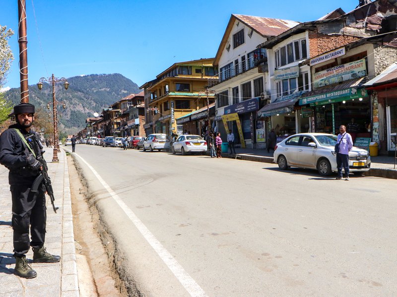 Anantnag: A security personnel stands guard in Pahalgam on the first anniversary of the terror attack in which 26 tourists were killed, in Anantnag district of Jammu and Kashmir on Wednesday, April 22, 2026. (IANS)