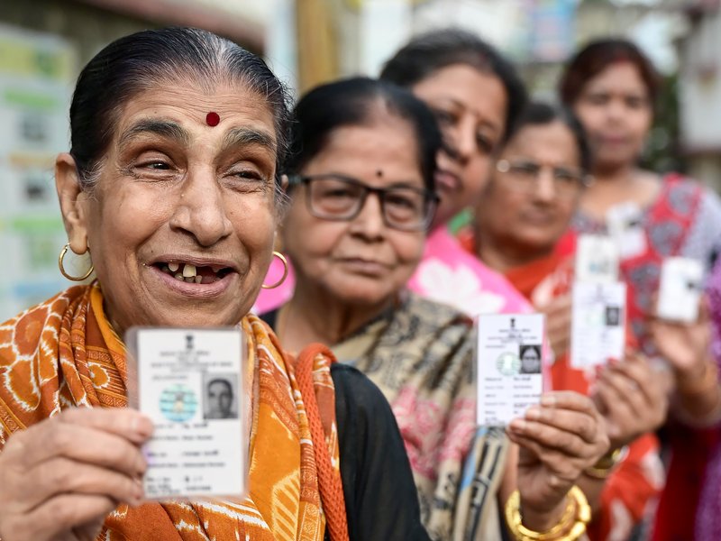 North 24 Parganas: Voters show their voter IDs as they stand in a queue to cast their vote during the second phase of the West Bengal assembly elections at a polling booth in North 24 Parganas on Wednesday, April 29, 2026. (Photo: IANS/X/@ECISVEEP)