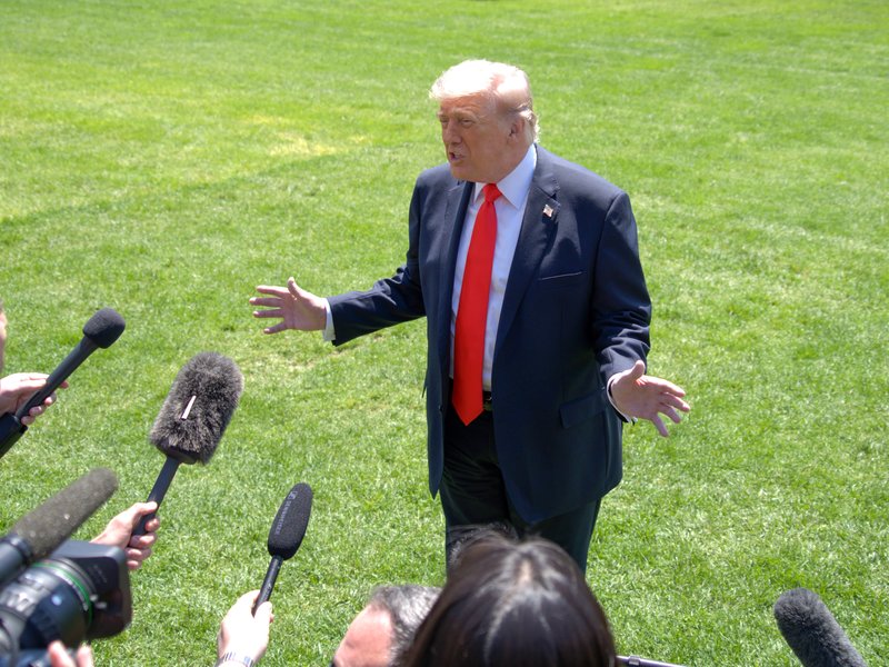 Trump reviews Iran deal, hints troop cuts