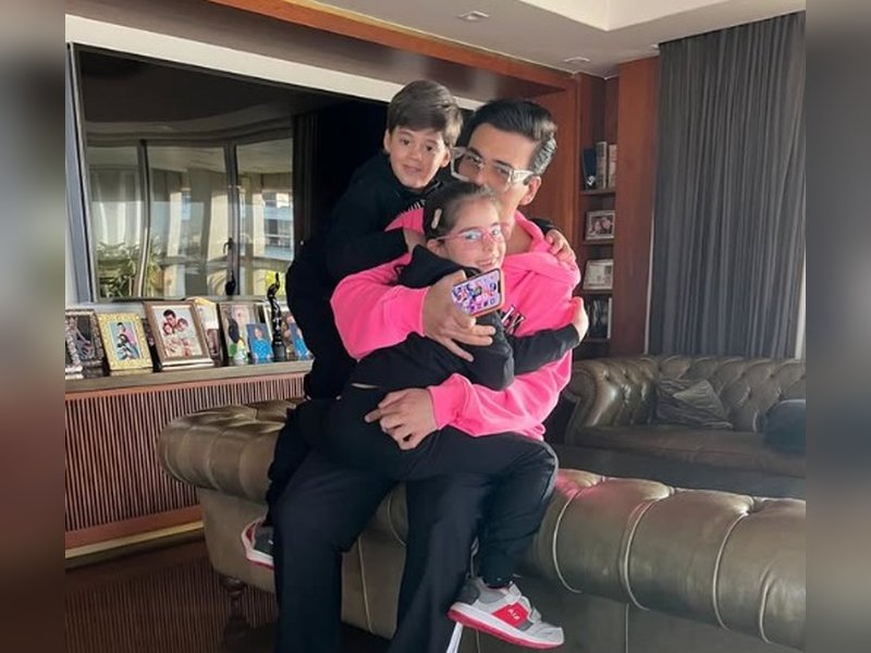 Karan Johar asks, 'What can replace this joy?' as he cuddles up with kids Roohi & Yash