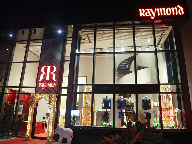 Raymond Limited’s Q4 profit slumps 99 pc on one-time loss