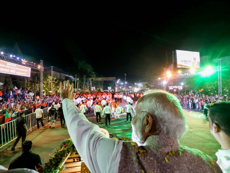 Vadodara: People gather to welcome Prime Minister Narendra Modi (unseen) during a roadshow in Vadodara, Gujarat on Monday, May 11, 2026. (Photo: IANS/PMO)
