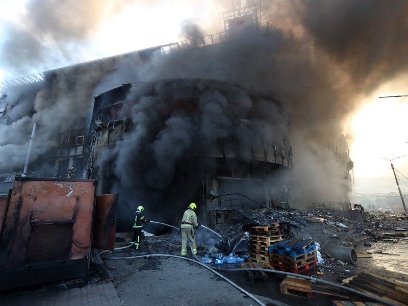 Kyiv: A firefighter attempts to put out a fire at a shopping center in Kiev, Ukraine, May 24, 2026. A massive ballistic missile attack struck the Ukrainian capital early Sunday, said Tymur Tkachenko, head of the Kiev City Military Administration. (Xinhua via IANS)
