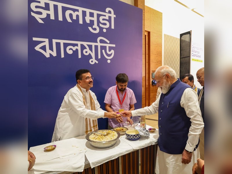 Bengal CM Adhikari serves 'jhalmuri' to PM Modi in NDA meeting