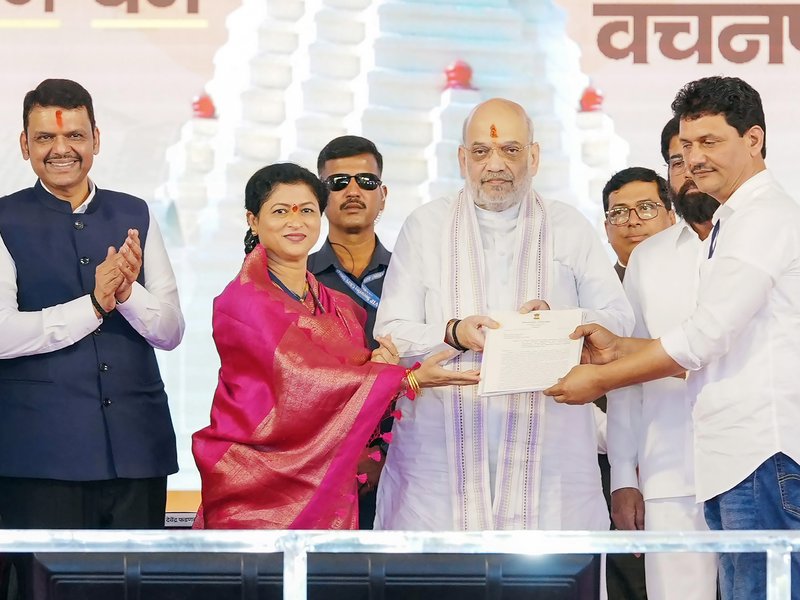 Kolhapur: Union Home and Cooperation Minister Amit Shah and Maharashtra Chief Minister Devendra Fadnavis attend the Bhavya Krutadnyata Sohala and public meeting organised in support of the Ambabai Temple project in Kolhapur district of Maharashtra on Saturday, June 20, 2026. (Photo: IANS/X/@Devendra_Office)