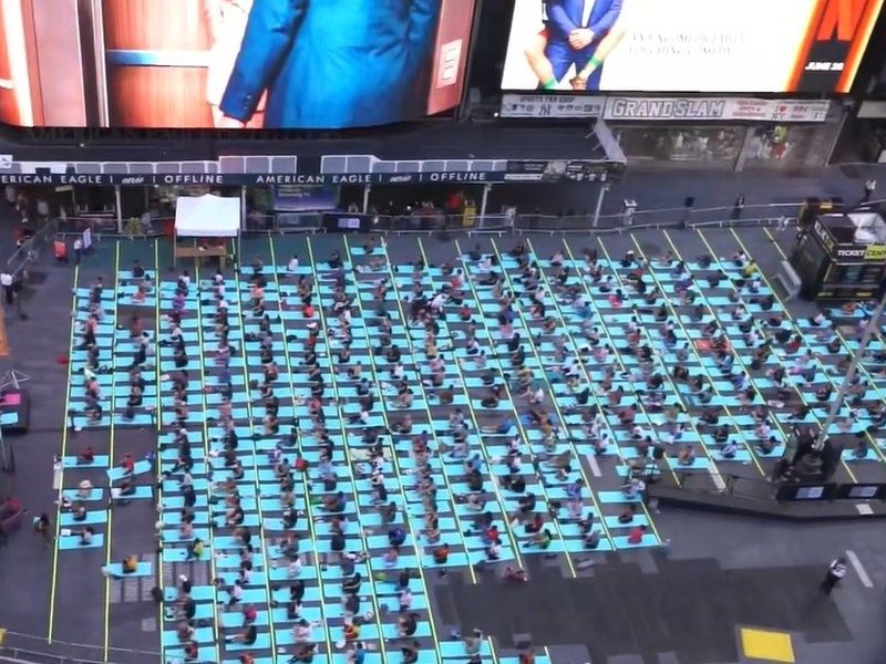 International Yoga Day dawns on Times Square with people reflecting universality with all nations and ethnicities