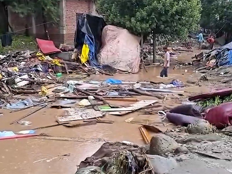 Rajouri: Rubble of damaged structures lies on a road after flash floods triggered by intense rainfall in Rajouri district of Jammu and Kashmir on Sunday, July 19, 2026. (Photo: IANS/Video Grab)