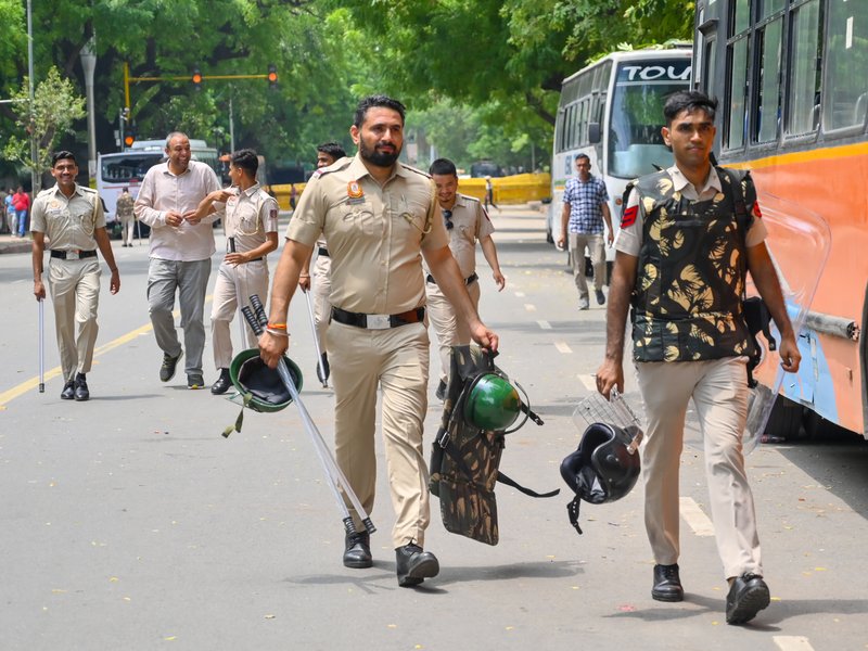 New Delhi: Police personnel carry protective gear as they remain deployed during the Cockroach Janata Party’s protest demanding the resignation of Union Education Minister Dharmendra Pradhan over the alleged NEET paper leak and examination irregularities at Jantar Mantar in New Delhi on Thursday, July 23, 2026. (Photo: IANS)
