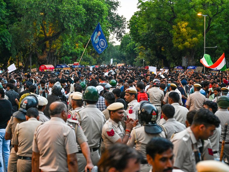 New Delhi: Security personnel stand guard as CJP supporters gather to stage a protest demanding the resignation of Union Education Minister Dharmendra Pradhan over the alleged NEET paper leak and examination irregularities, at Parliament Street in New Delhi on Thursday, July 23, 2026. (Photo: IANS)