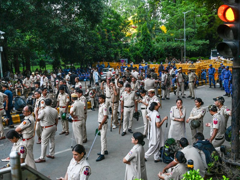 New Delhi: Security personnel stand guard as CJP supporters gather to stage a protest demanding the resignation of Union Education Minister Dharmendra Pradhan over the alleged NEET paper leak and examination irregularities, at Parliament Street in New Delhi on Thursday, July 23, 2026. (Photo: IANS)
