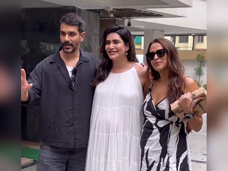 Karishma Tanna asks paps to stop focusing on her baby bump as she poses with Neha Dhupia, Angad Bedi