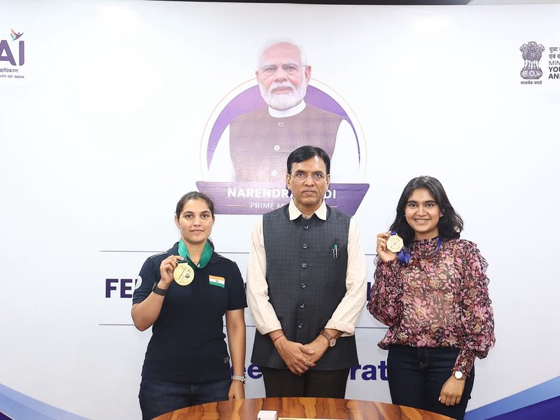 Union Minister of Youth Affairs and Sports and Labour and Employment, Dr Mansukh Mandaviya felicitates ISSF World Cup gold medallists Esha Singh, Neeru Dhanda. Photo credit: SAI Media