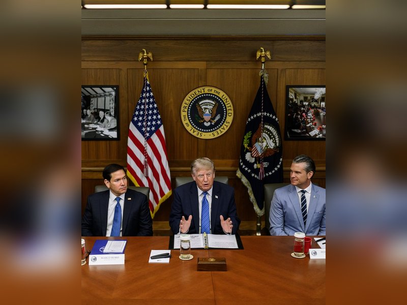 Trump touts record gains at Camp David