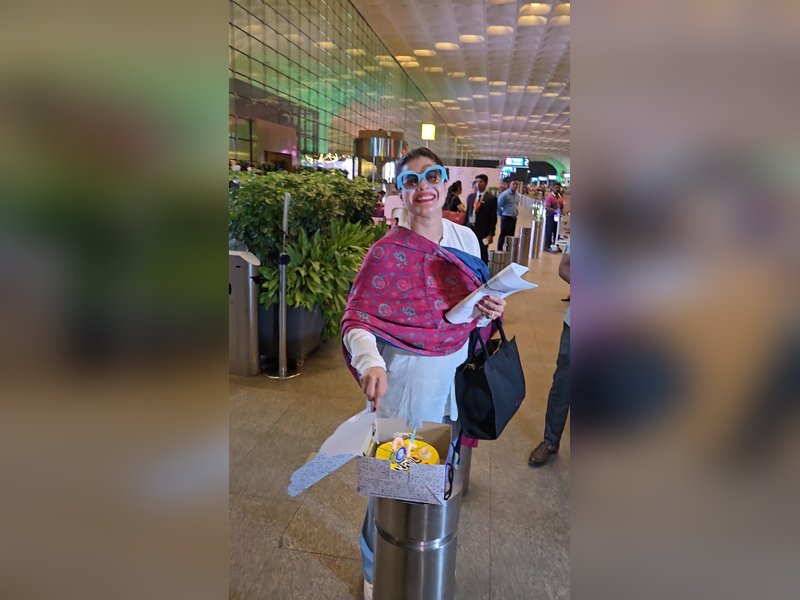 Kajol cuts birthday cake with paps at airport, shy Nysa Devgn stays out of frame