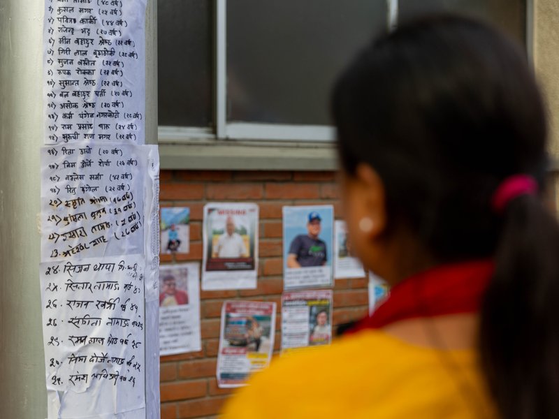 Families put up posters outside Kathmandu hospital in hope of finding their loved ones  
