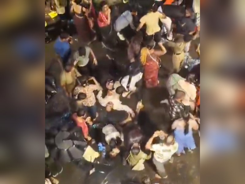 Kolkata: People help the injured after a stampede-like situation occurred at the Chorbagan Sarbojanin Durga Puja pandal in Kolkata, West Bengal, on Saturday, October 17, 2026. (Photo: IANS/Video Grab)