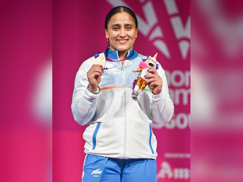 Prime Minister Narendra Modi congratulates silver medallists Harjinder Kaur, Gulveer Singh for their performances in Glasgow. Photo credit: IANS 