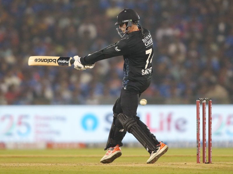 Skipper Mitchell Santner’s unbeaten 47 powers New Zealand to record 208/6 against India in the second T20I at the Shaheed Veer Narayan Singh International Stadium, Raipur, on Friday. Photo credit: IANS