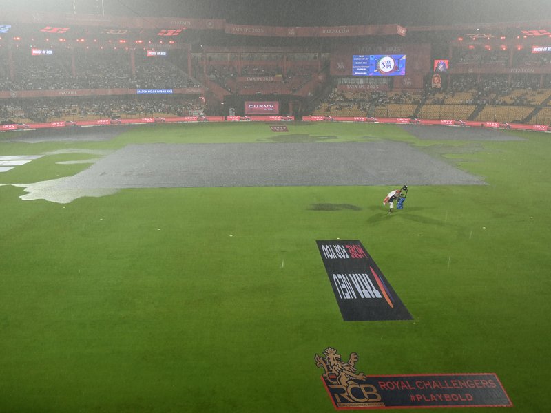Royal Challengers Bengaluru (RCB) fans come out in numbers despite rain for the match against Kolkata Knight Riders at the M. Chinnaswamy stadium on in Bengaluru on Saturday, to hail Virat Kohli on Test retirement. IANS Photos
