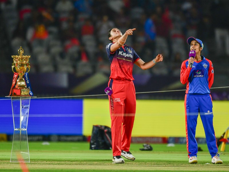Both teams unchanged as Royal Challengers Bengaluru elect to bowl first against Delhi Capitals in title clash of the Women's Premier League (WPL) 2026 at the BCA Stadium in Kotambi, Vadodara, on Thursday. Photo credit: IANS