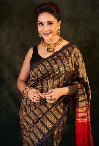 <div>Madhuri Dixit stuns in her Sonepuri silk saree, carries 'quiet grace on every fold'</div>